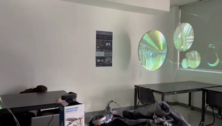 Wall with the circles projecting an airport image that matches the background